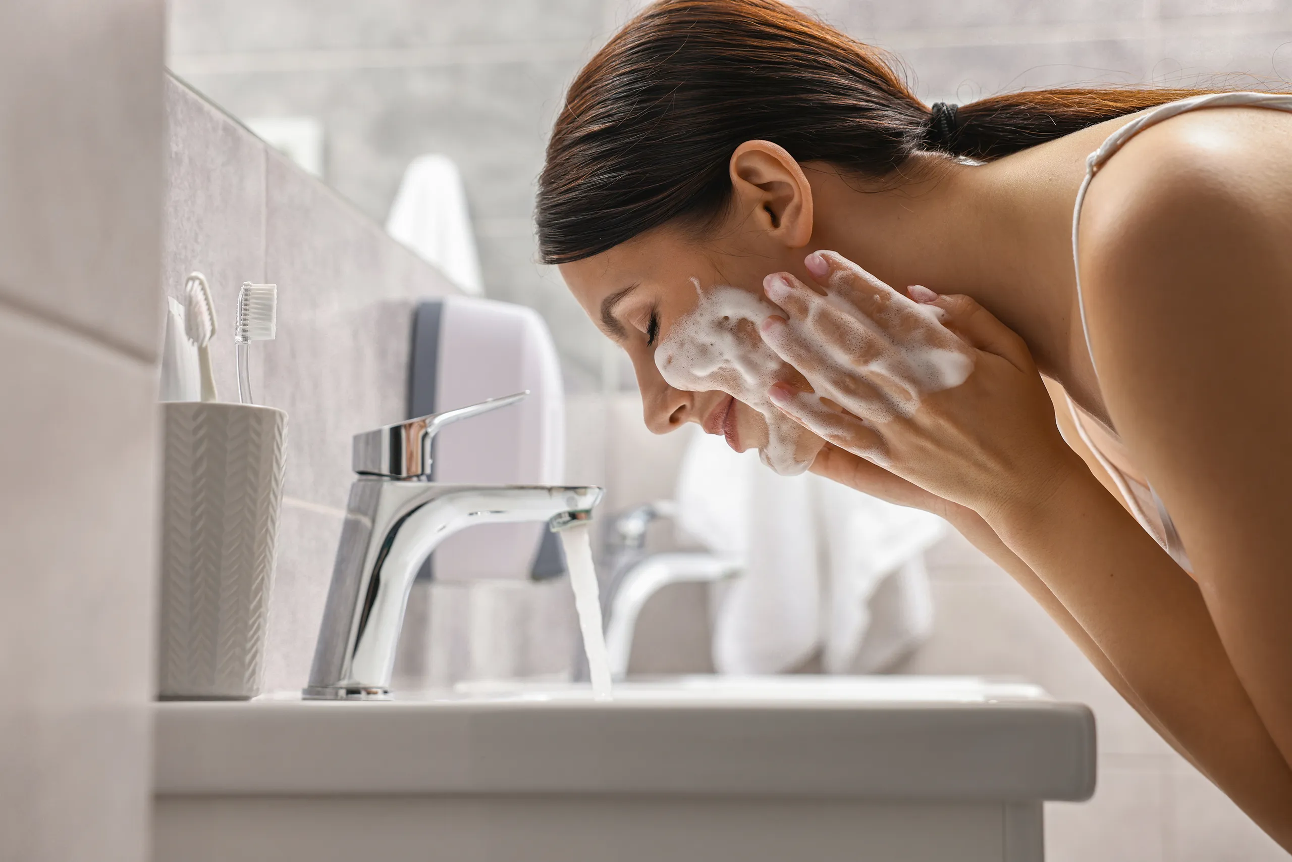 Washing face before applying LED face mask